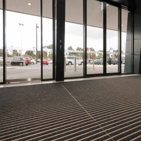 Installation picture of the Aluminum Architectural Mats in a shopping centre.