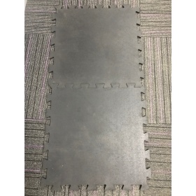 Product image of two interconnecting gym mat tiles slotted together 