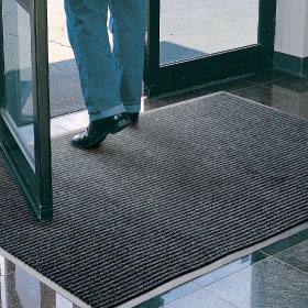 Product image of charcoal, polypropylene Super Brush Mat used in a residential building as an entry mat