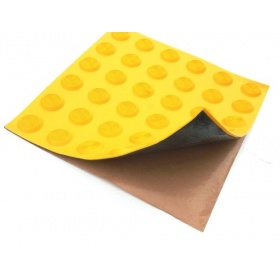 Product image of the peel and stick backing of the tactile tiles for simple installation
